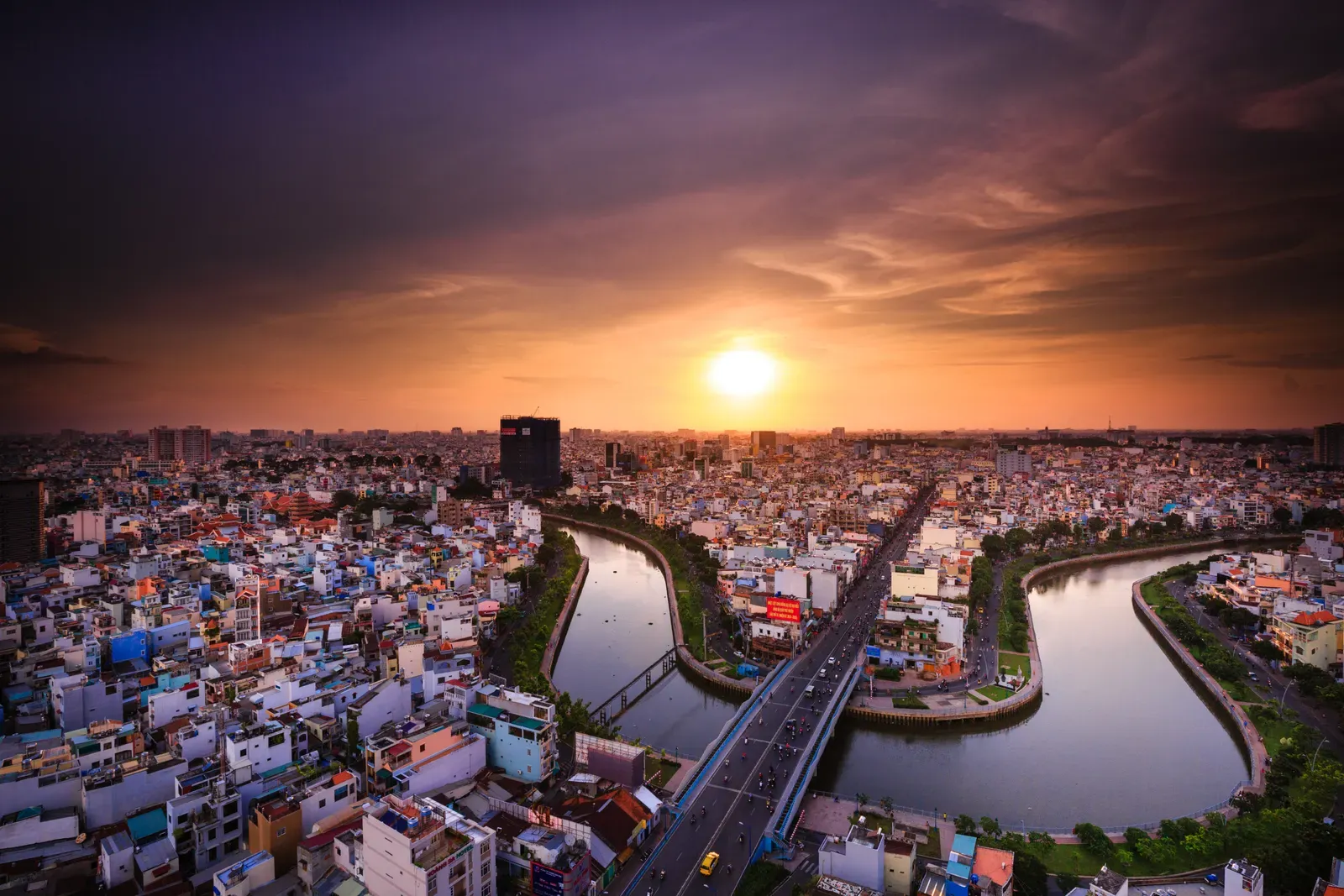 Ho Chi Minh City skyline and the Saigon River at sunset