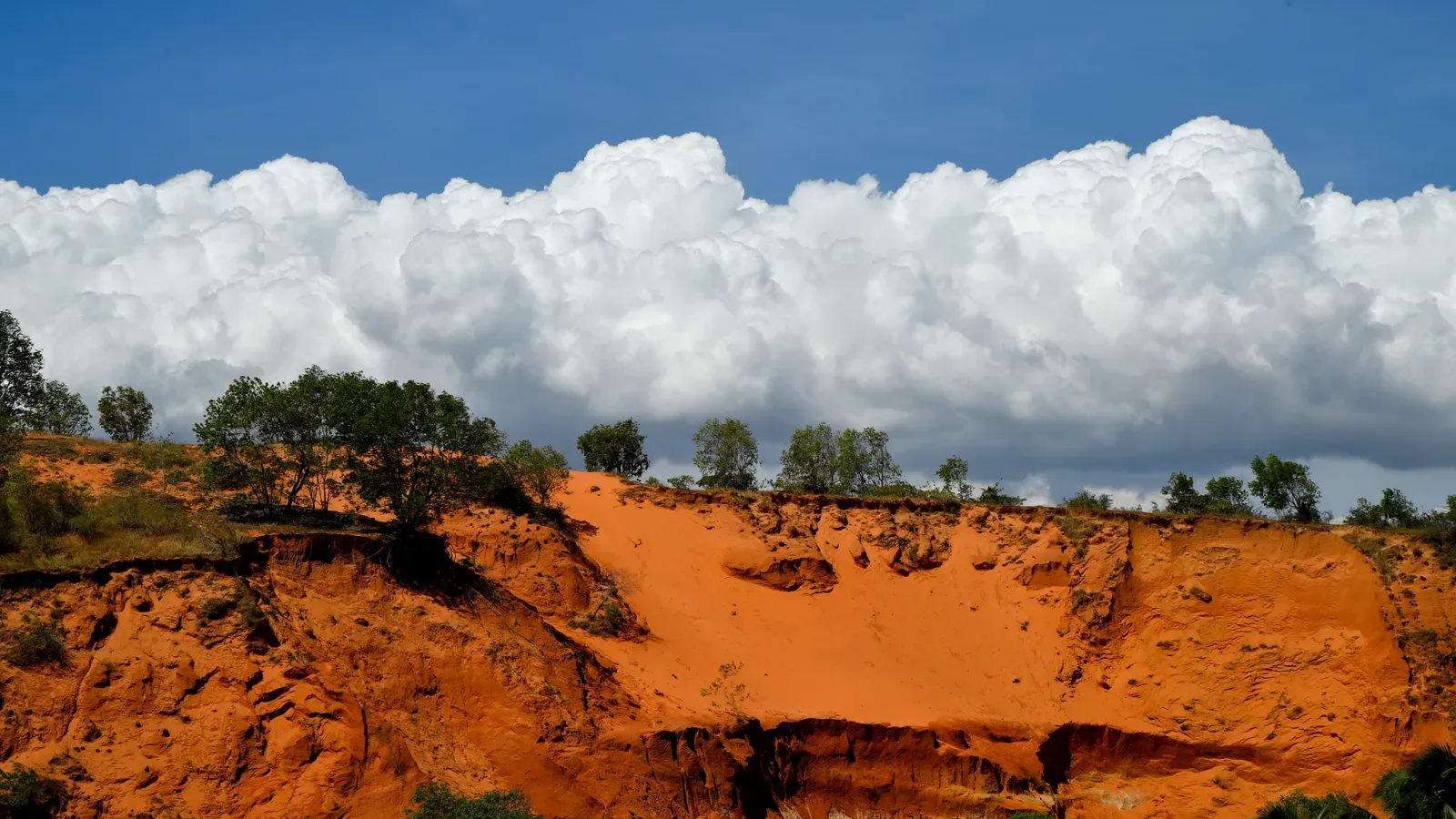 Red sand dunes near Mui Ne under a blue sky