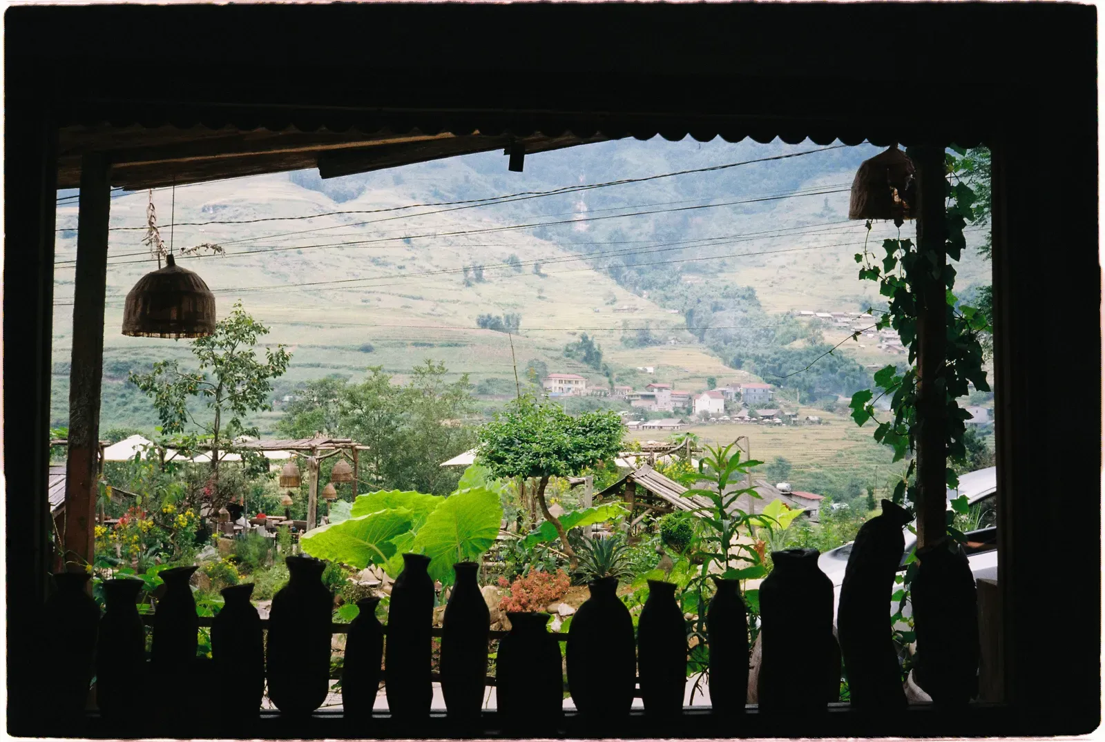 A Sapa village surrounded by green rice terraces