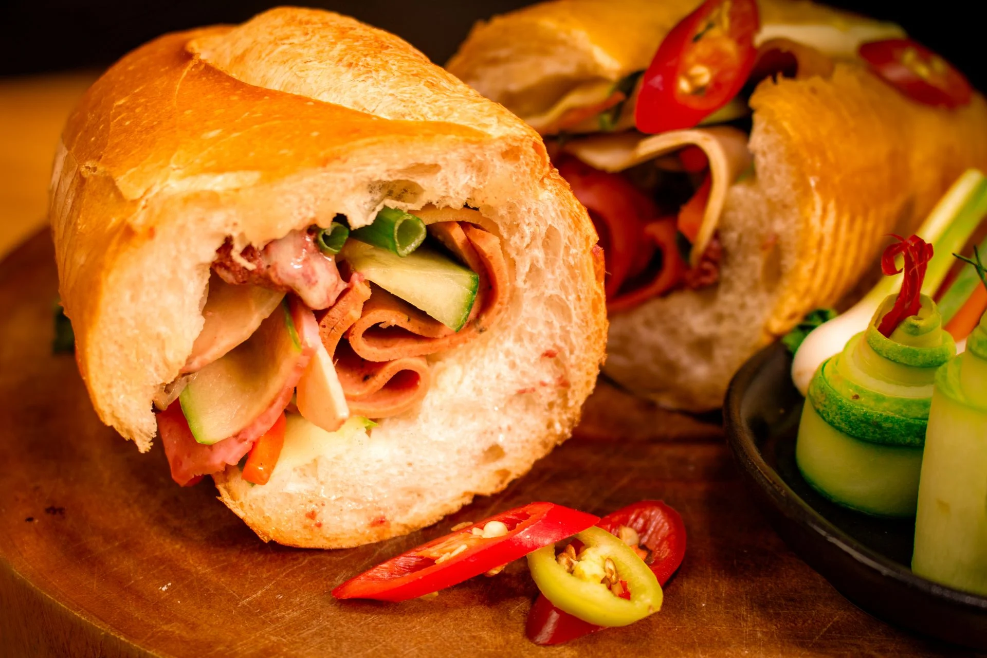 Crisp bread and contrasting fillings are central to a good banh mi Vietnamese banh mi with pork, pickled vegetables, cucumber and cilantro